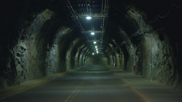 A road with no light hardly underground at the Cheyenne Mountain military base complex.