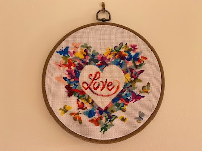 Heart cross stitch circular pattern in embroidery hoop