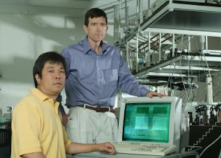 Caption: Haiyu Wang, Neal Woodbury (l-r) and colleagues at the Biodesign Institute at ASU have provided new insight into the basic mechanisms of photosynthesis, a biological process that supports all life on earth. The biodesign team has shown that it is protein motion that determines the dynamics of the initial electron transfer reactions of photosynthesis, rather than static interactions between cofactors. The Biodesign researches use an ultrafast laser facility to capture 'snapshots' of the electron transfer at femtosecond rates, or a fifteen millionth of a second. Credit: Barb Backes, Biodesign Institute at Arizona State University, Usage Restrictions: None.