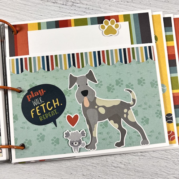 Dog pet scrapbook album page with pocket and pawprints