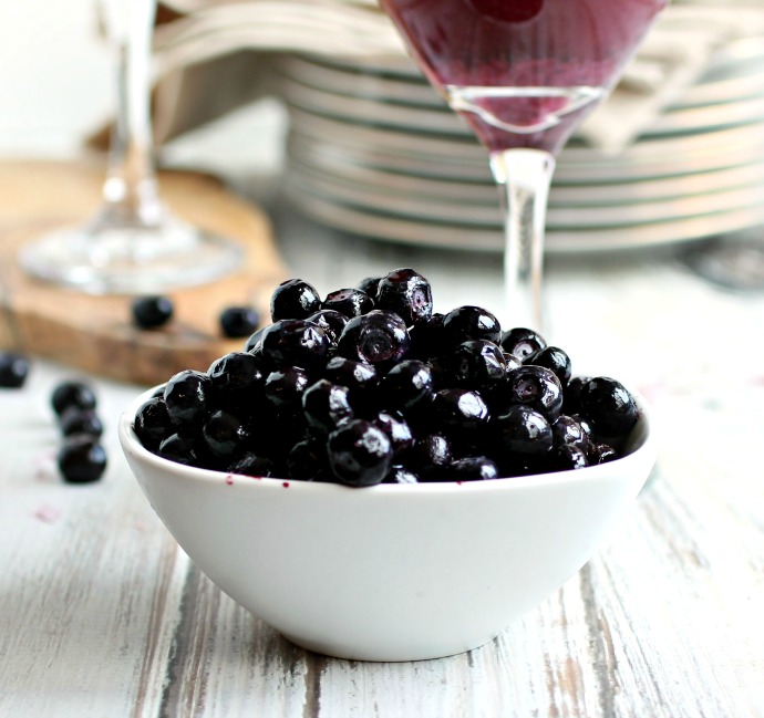 Recipe for a vodka and wine cocktail with frozen blueberries and vanilla ice cream.