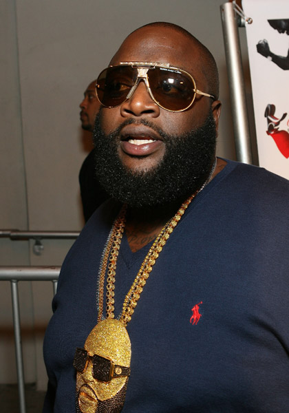 rick ross chain of himself wearing a chain. rick ross tattoos on face