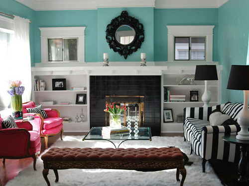 the black and white stripe sofa works beautifully with the hot pink