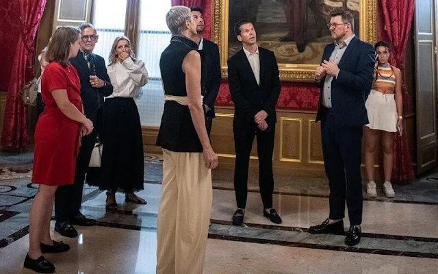 Princess Charlene wore a sleeveless single breasted jacket by Louis Vuitton, and pants by same brand