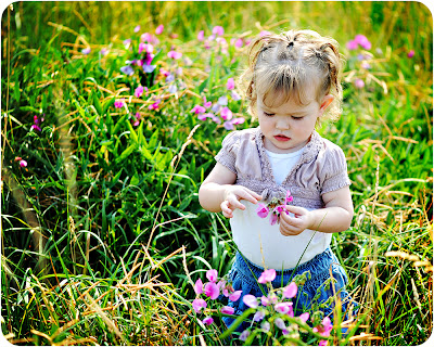 Beautiful Baby girl playing in garden photos to download