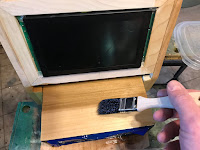 Varnishing the cabinet