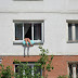 Russian Woman Sunbathing by Hanging Out Her Apartment Window Has Neighbors on Edge