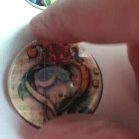 Glass just laid on photo. You can see circle of glue in the center.