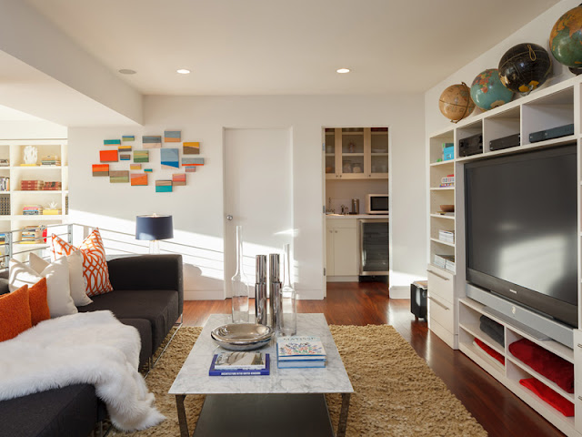 Picture of small sitting area and large tv on the gallery in the bedroom