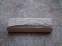 Use the wooden stick to smear a layer (about 0.5 cm thick) of acrylic glue on the front side of the mezuzah