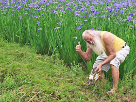 Muddied Ryukyu Mike, flip-flops off, iris field