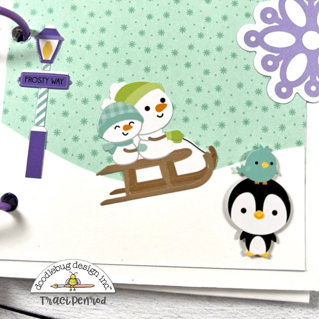 Snow Day Winter Scrapbook Mini Album page with snowflakes, snowmen on a sled, a penguin, and a little bird