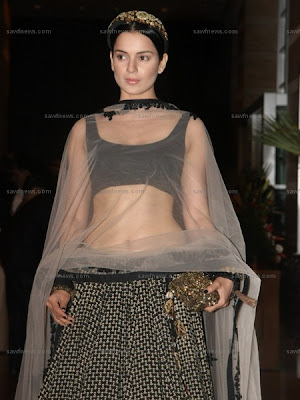  a midriff baring black and beige Sabyasachi lehenga set at the wedding 