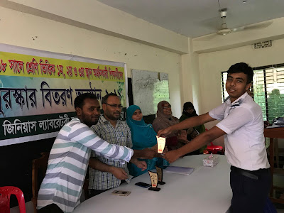 Reciving Awarad from the Director of Genius LSC, Meherpur