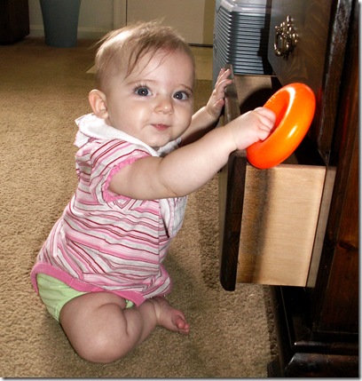 Elaine 6 months playing in drawer