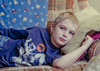 young boy on sofa