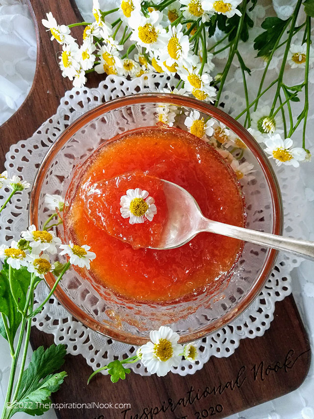 Small batch peach jam with a teaspoon on a white doily surrounded by camomile flowers, small batch peach jam without pectin, peach jam low sugar, low sugar peach preserves, low sugar peach preserves no pectin, peach jam less sugar