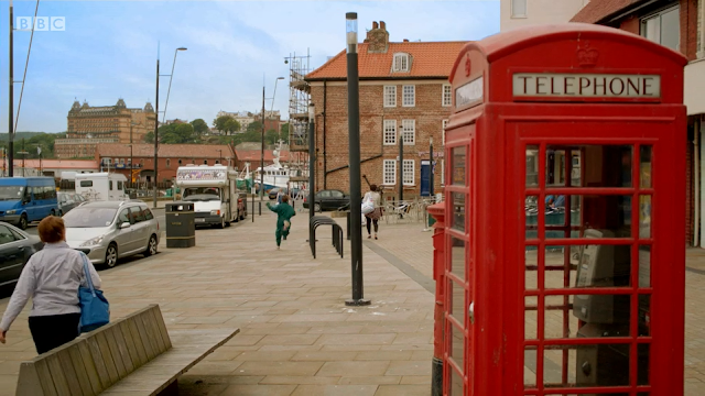 Sandside, Scarborough with Grand Hotel in the background and red phone box in the foreground. From All at Sea Series 1 Episode 6.