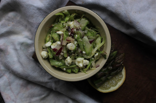 Raw asparagus with sesame oil, seeds, feta and red onion. 