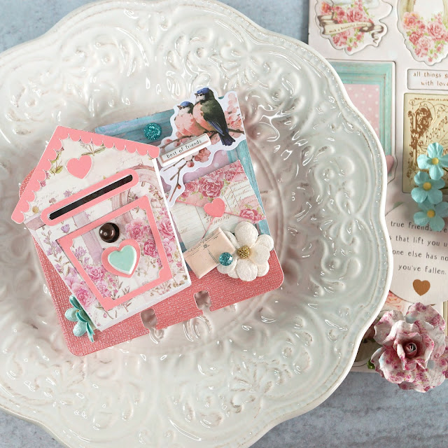 Heidi Swapp Memorydex Valentine's advent calendar made using the Prima With Love collection by Frank Garcia; love letters and birdhouse shaped mailbox die cuts decorated with ephemera, puffy stickers, paper flowers and jewels