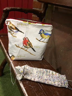 Bird project bag and sock being knitted