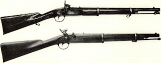 Cook & Bro. copied the Enfield faithfully in most models. Long arm was adapted for angular bayonet. Short rifle in New Orleans make may have been fitted for sword bayonets, but few specimens found reflect order of 1864 discontinuing issue of sword bayonets in South. Carbines were fitted with hinged rammers in early production, later used simple swell-end rod. Bottom carbine in Smithsonian Institution, is like-new specimen, shows twist pattern of iron barrels invented by Burton to increase strength in poor materials.