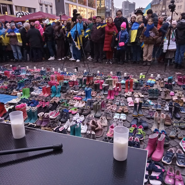 Children' shoes are displayed during demonstration of solidarity with the people of Ukraine to remember the over 400 children killed by Russia's attacks against Ukrainian hospitals and schools