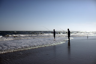 a father and son surf fish