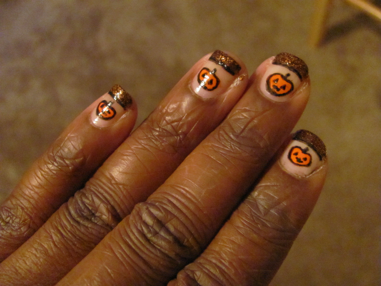 designs on my nails these are my two designs pumpkins