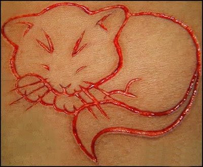 more photos in Burning Man Tattoos and Scarification more photos in Burning Man Tattoos and Scarification
