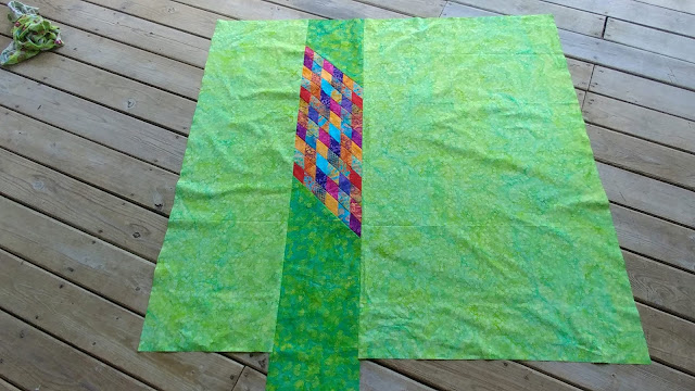 Scrappy Lonestar quilt using Empress Garden fabrics by Island Batik