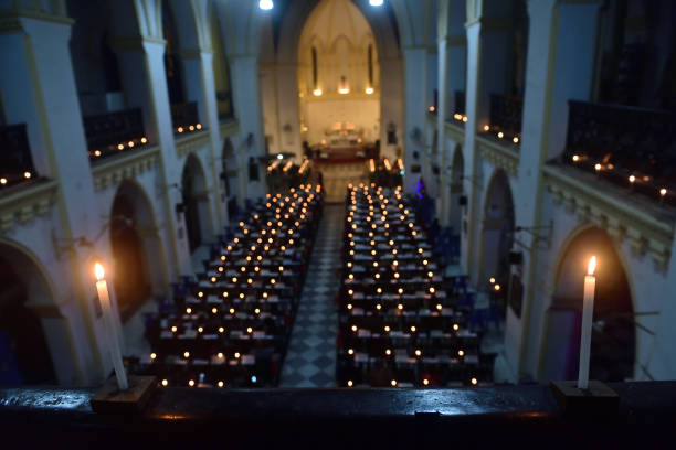 Candles of the Christian devotees can be seen at a church in Kolkata during the Midnight Mass in Kolkata, India on December 24, 2022.