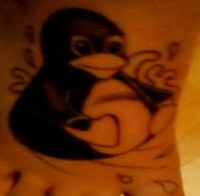 Although most tattoos are very important, penguin tattoos are a rare exception. Instead of being a bit deep and meaningful to the user, tattoos are a fun little penguin body art whimsical.  Most penguin tattoos done in cartoon style. These birds are often irresistible, even cute. These features are regularly he is their appearance or with the addition of props. For example, the penguin can be unusually large eyes, which carry a sweet expression, can be very plump bodies, and look as if they were waving around. What props, this can be something as simple as a winter cloche hat Daisy is filled to the brim, or a scarf wrapped around the neck with ease.  Tattoos cartoon penguin style does not always have to be cute. Many tattoos penguins on the basis of this creature in action, a penguin on a surfboard in water with ice in a round of fisticuffs with a polar bear, or - playing with color - an elegant top hat penguin dancing the waltz with its equivalent for women with curves.  Penguin tattoos may leave the comic book hero style and has a smoother appearance. One idea is to present an outline of the bird, perhaps filling in small elongated shapes to show its beak, flipper and part of the back. You can also create a more modern style and use of clean lines and which define the circular body, and several hues of bright blue, black and gray to give it a more dimensional. If you do not want to take everything a little kitsch, you can create a penguin robot, which could have a wide range of colors for a metallic appearance, and thus take its fins, jet explode around his cock, or even shoots lasers from his eyes.