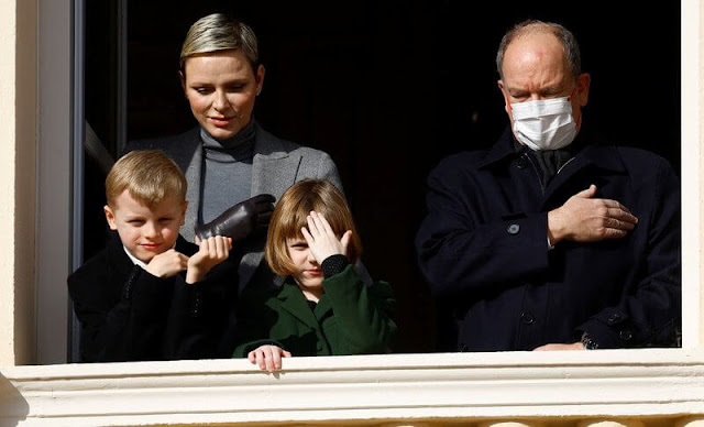 Prince Albert, Princess Charlene, Prince Jacques and Princess Gabriella. Charlene wore a grey jacket, sweater and skirt by Akris