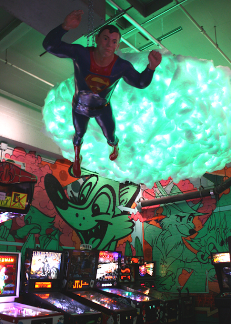 Superman flying high above arcade games at Can Can Wonderland