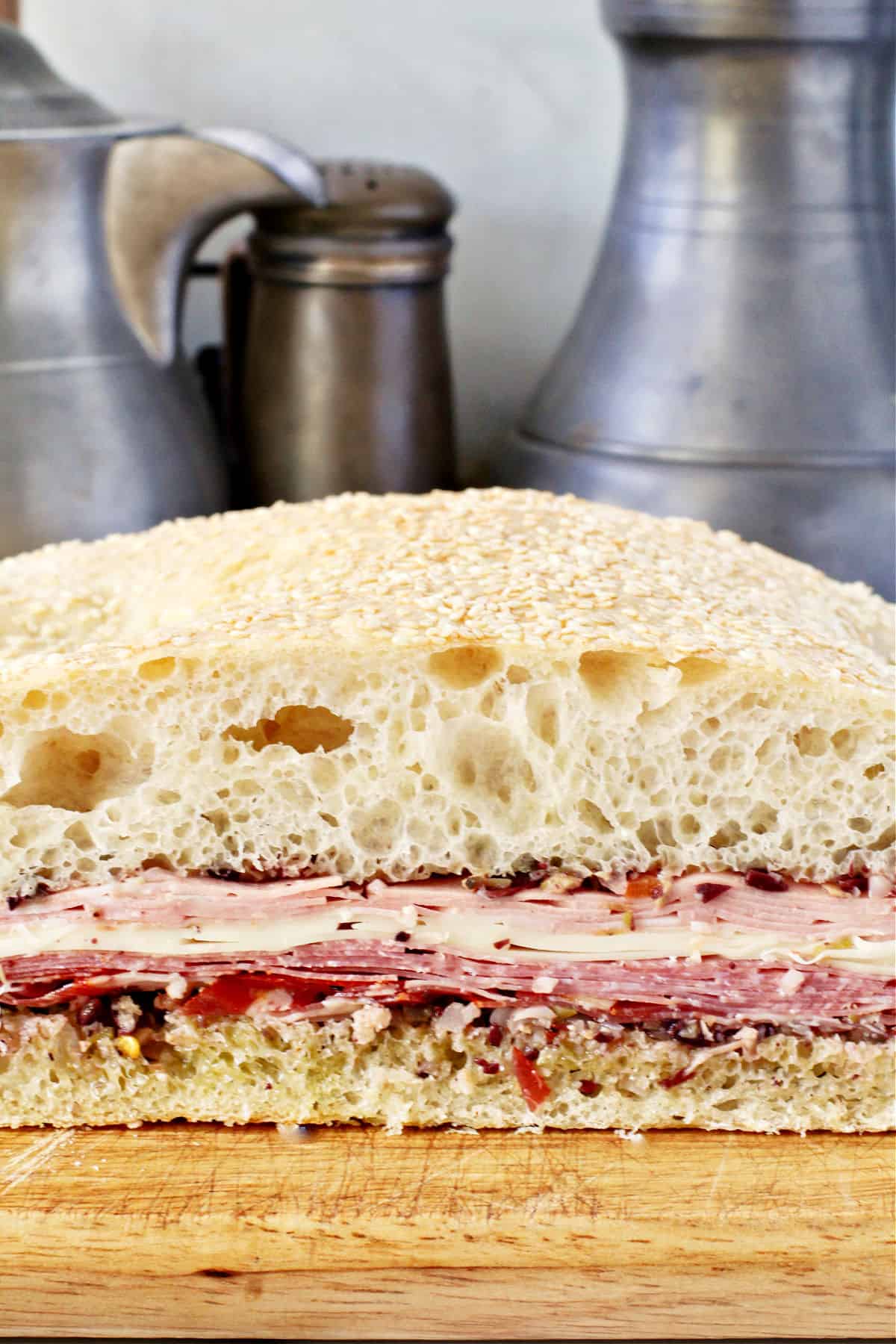 Muffuletta Sandwich on a cutting board.