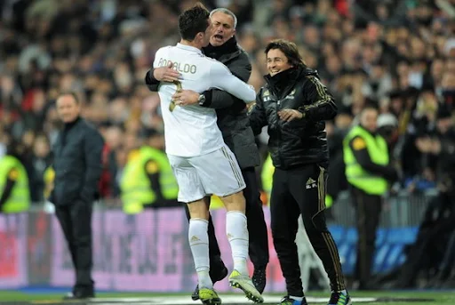 Cristiano Ronaldo celebrates his hat-trick with coach José Mourinho