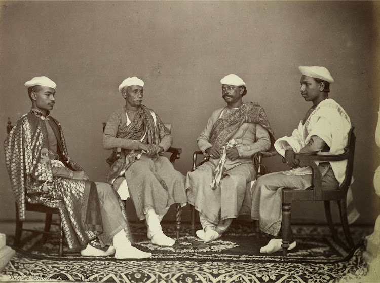 Group Portrait of four seated men, described as Bankers Delhi - 1863