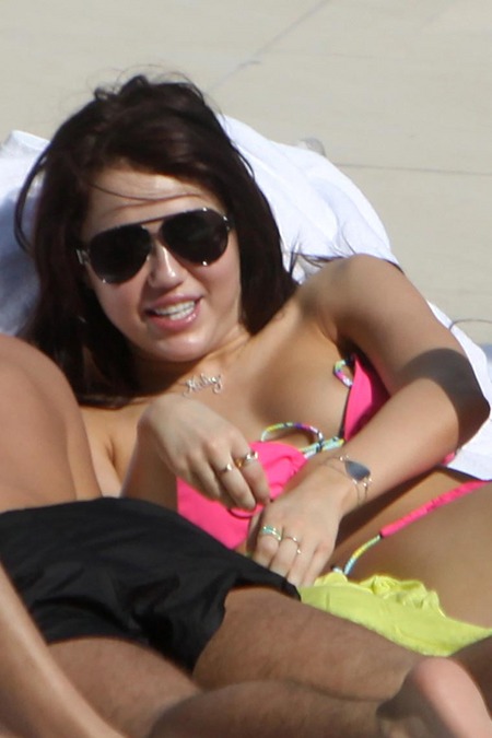 miley cyrus tattoo bikini. Here are more shots of Miley