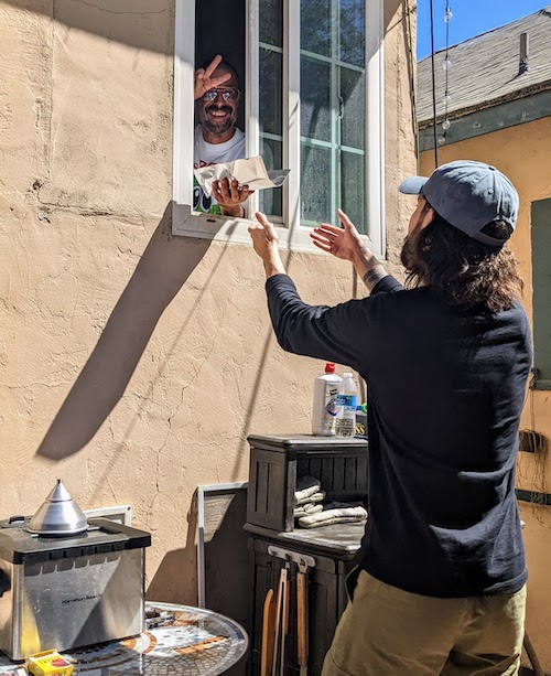 Passing food from kitchen out a window to back patio