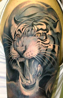 http://allaboutbodyart.blogspot.com/ - Tiger_Tattoo_half_sleeve_tattoo_design