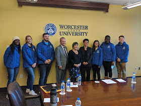 Worcester State students pose with members of the Higher Education committee before touring the WSC campus on Friday, Nov 1