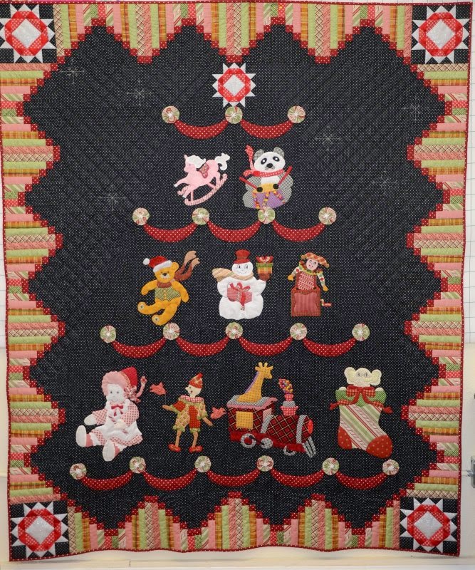 http://www.inbetweenstitches.com/shop/Patterns/p/Toyland-Tree-x2499231.htm