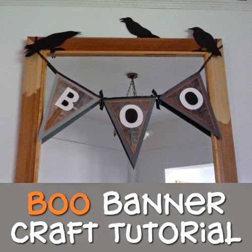 Paper handmade Boo garland hung across a mirror as decoration