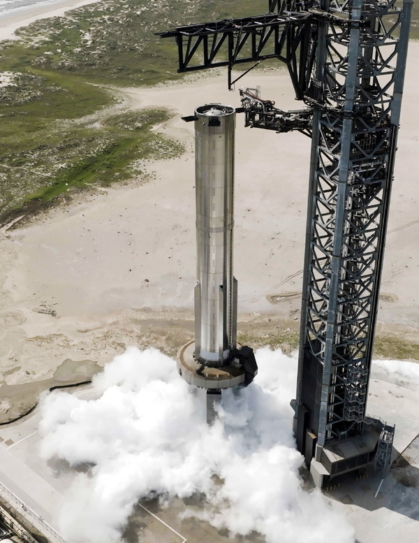 Booster 9 conducts a spin prime test of its Raptor 2 engine pumps atop the Orbital Launch Mount at Starbase in Texas...on August 4, 2023.