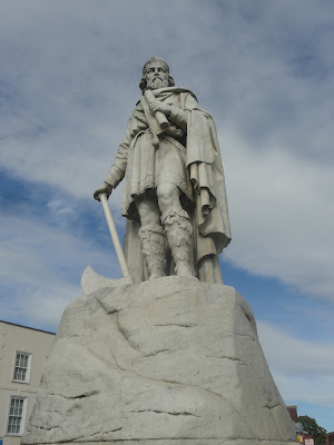 large statue of King Alfred, with an axe