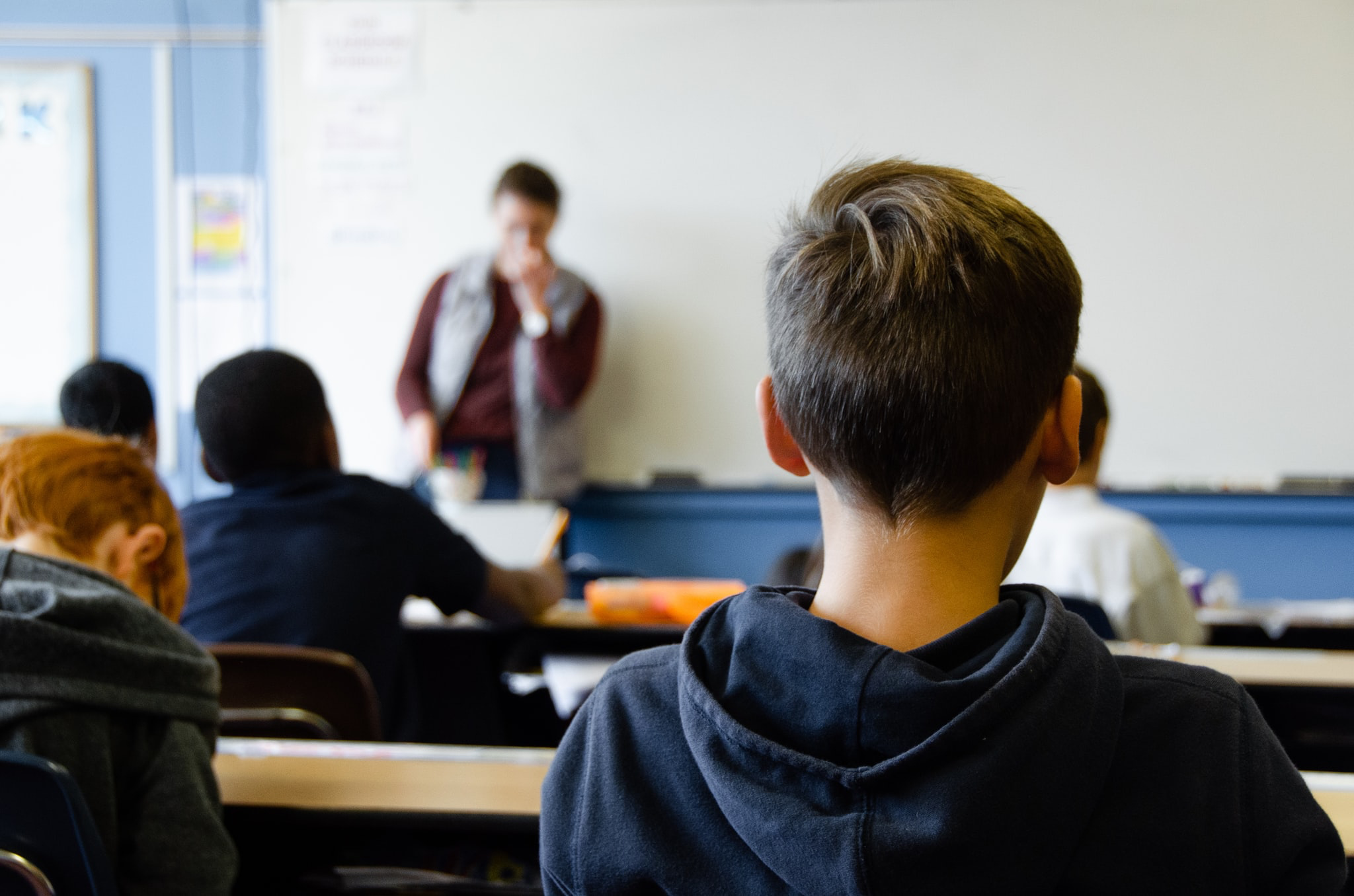 boy sat in a classroom