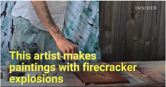 An artist makes paintings with firecracker explosions
