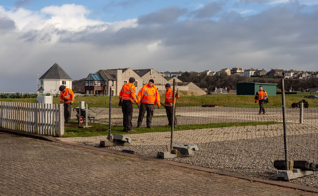 Photo of workers laying turf on the caravan site last week