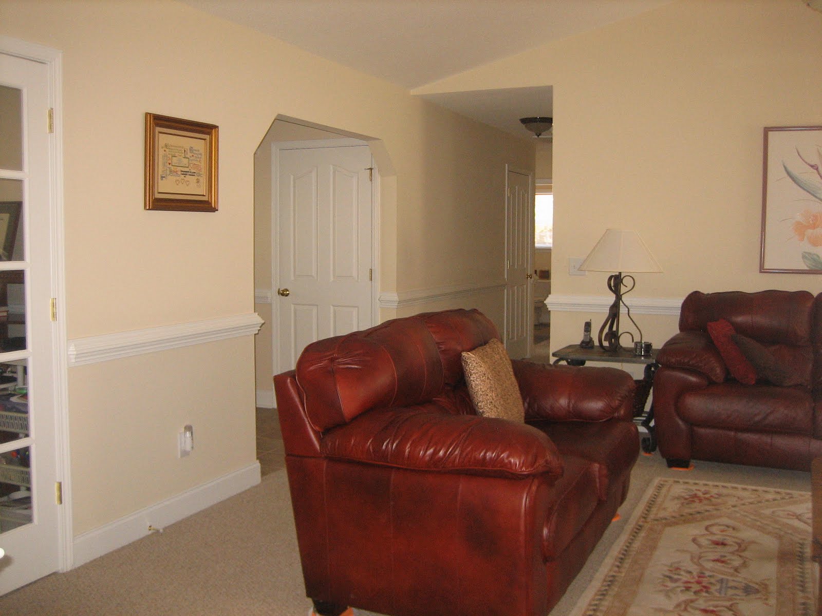  ceiling with ceiling light with fan. French doors to living room. We title=